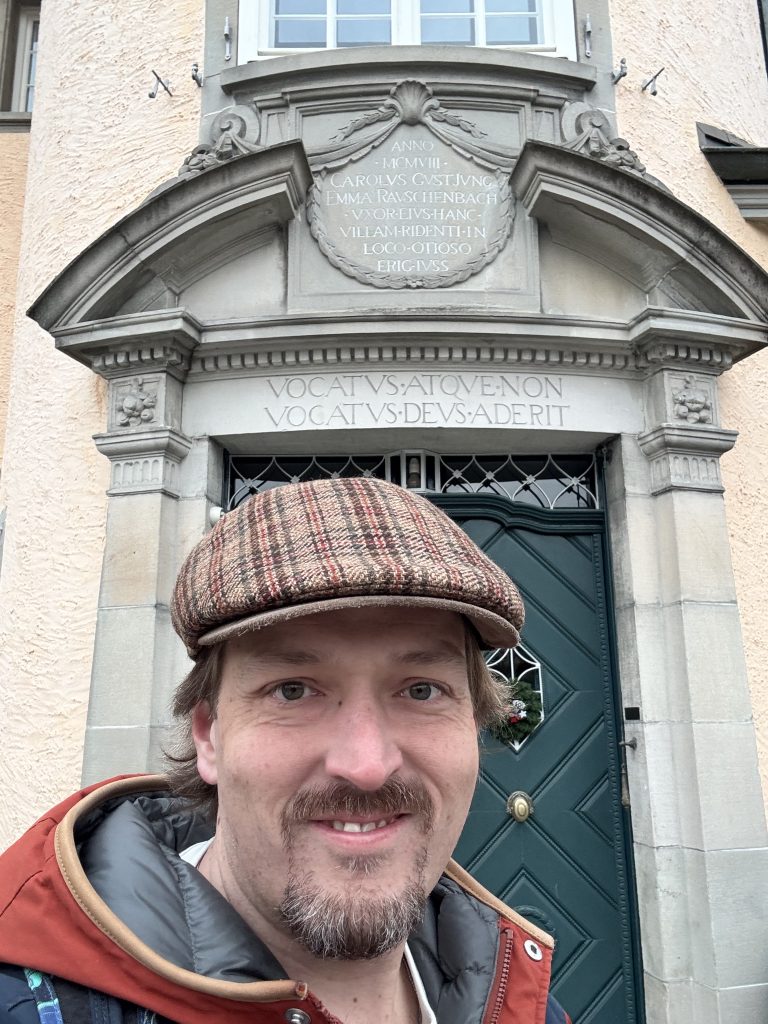 Charles Zimbrick-Rogers, a Jungian Analyst in the Philadelphia area, with an office in Narberth, PA, standing outside C. G. Jung's house in Kusnacht.